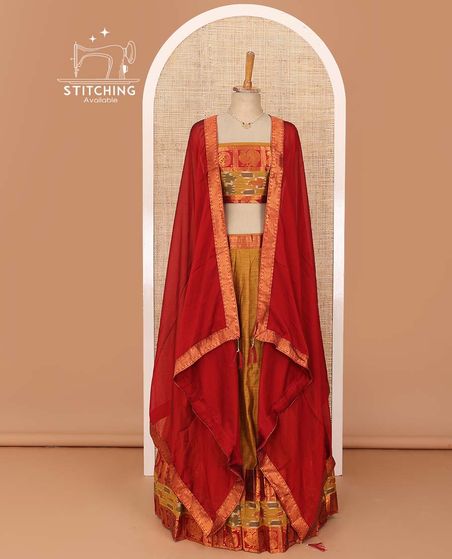 Mustard lehenga set, contrast traditional zari, and ikkat border skirt, matching blouse, and contrast zari bordered plain dhavani