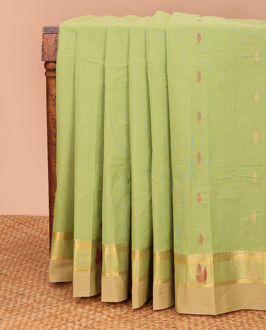 Parrot green buttas kanchi cotton saree, contrast thread and zari paisley border, and pallu of chevron and leaf motifs