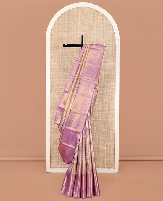 Pink Kanchipuram Silk Saree, Majestically Detailed with Zari Jacquard Design All Over Its Body, Highlighted by a Zari Border of Thilakam, Diamond, Mayil Kann, and Floral Designs, and Pallu of Jaal Designs, and Paired with a Matching Blouse
