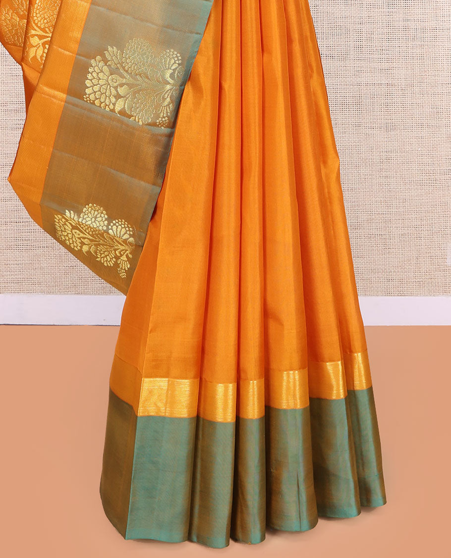 Orange Kanchipuram Silk Saree, Woven with Floral Zari Buttas, a Contrast Floral Zari Design Border, Floral Design Pallu, and a Contrast Blouse