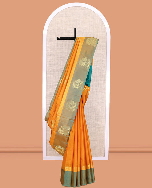 Orange Kanchipuram Silk Saree, Woven with Floral Zari Buttas, a Contrast Floral Zari Design Border, Floral Design Pallu, and a Contrast Blouse