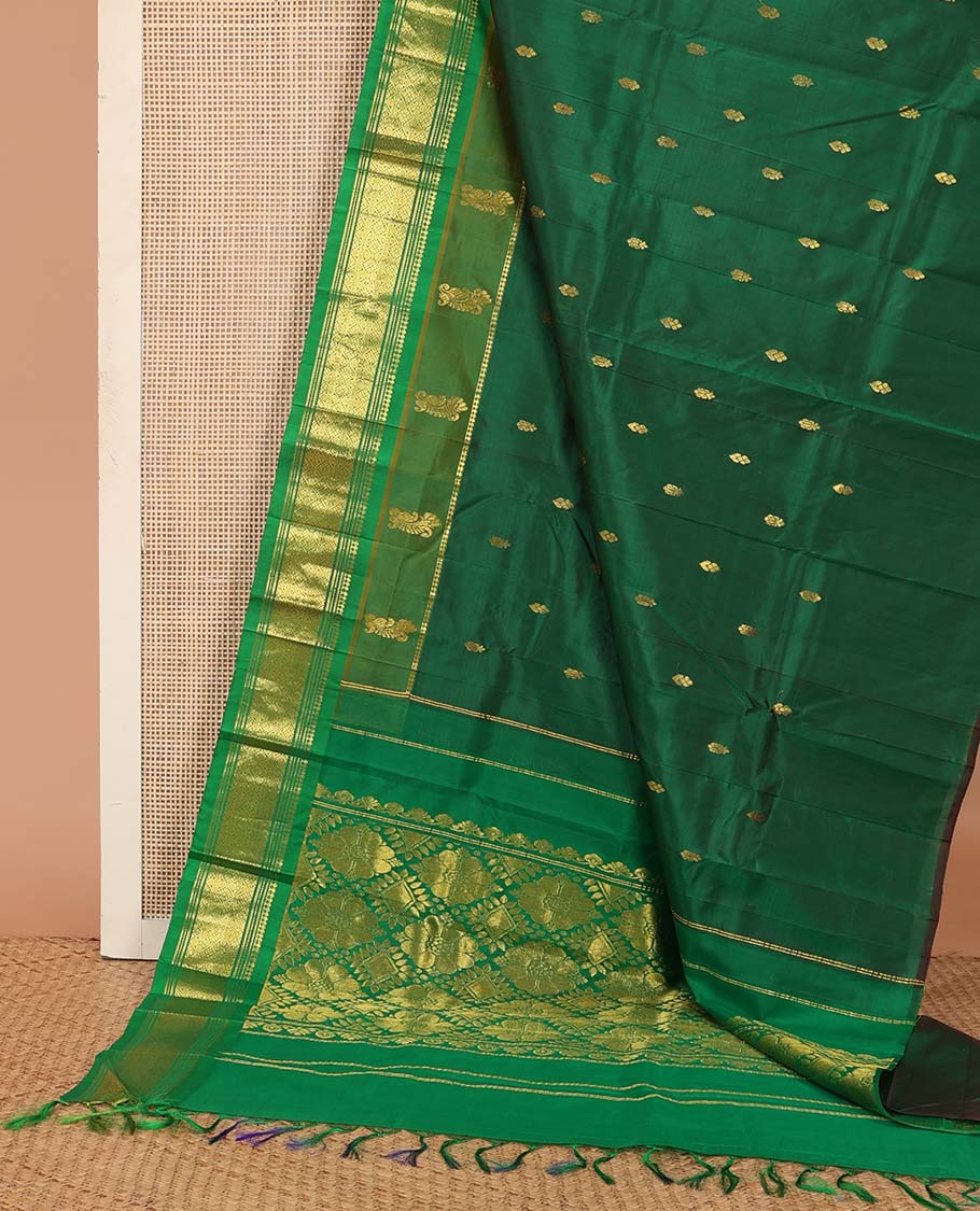 Green zari buttas Kanchipuram silk saree, contrast one-sided border of paneer sombu, banaras, muthu, and jaal designs, and floral-geometric pallu