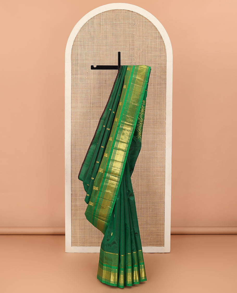 Green zari buttas Kanchipuram silk saree, contrast one-sided border of paneer sombu, banaras, muthu, and jaal designs, and floral-geometric pallu