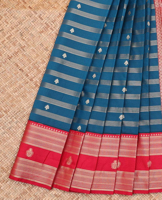 Blue Budget Silk Saree, Elevated with Zari Buttas and Stripes All Over Its Body, Complemented by Captivating Contrast Traditional Zari Designs Woven Border, Grand Jaal Pallu and Paired with a Contrast Blouse