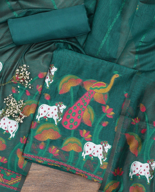 Green material chudidar set, hand-painting style Pichwai lotus, cow and peacock printed top, plain bottom and dupatta mirrors the same top print