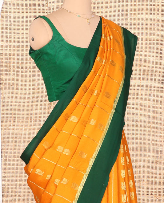 Orange Mysore Silk Saree, Embellished with Peacock Buttas and Stripes Across Its Body, Complemented by Contrast Border, Pallu Steeped with Traditional Zari Designs, and Paired with a Contrast Blouse
