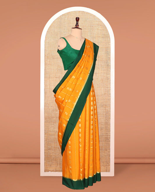 Orange Mysore Silk Saree, Embellished with Peacock Buttas and Stripes Across Its Body, Complemented by Contrast Border, Pallu Steeped with Traditional Zari Designs, and Paired with a Contrast Blouse