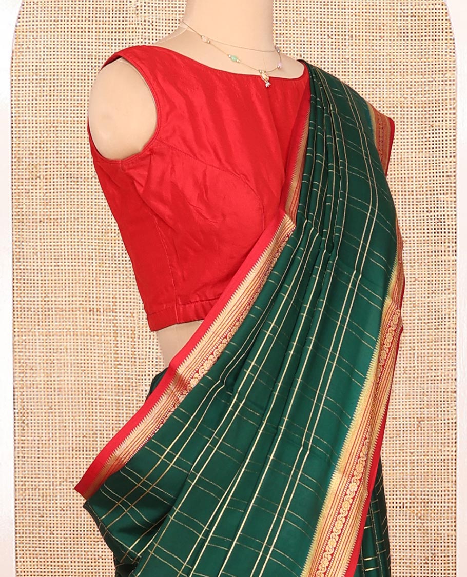 Green Mysore Silk Saree, Gleamed up with Zari Checked Design on its Body, Complemented by Captivating Contrast Border of Traditional Zari Designs, Pallu of Tropical Flora and Flamingo Bird Designs, and Paired with a Contrast Blouse