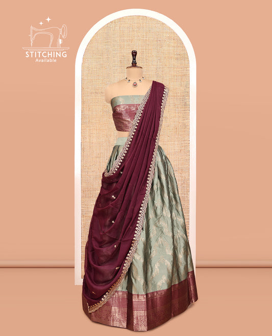 Green Banarasi Half-Saree, Embellished with Jacquard Design, a Contrast Traditional Zari Border, a Matching Blouse, and a Contrast Embroidered Dhavani