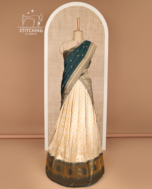 Cream zig zag design banaras half saree with contrast zari design border , checked zari design blouse & floral zari design dhavani