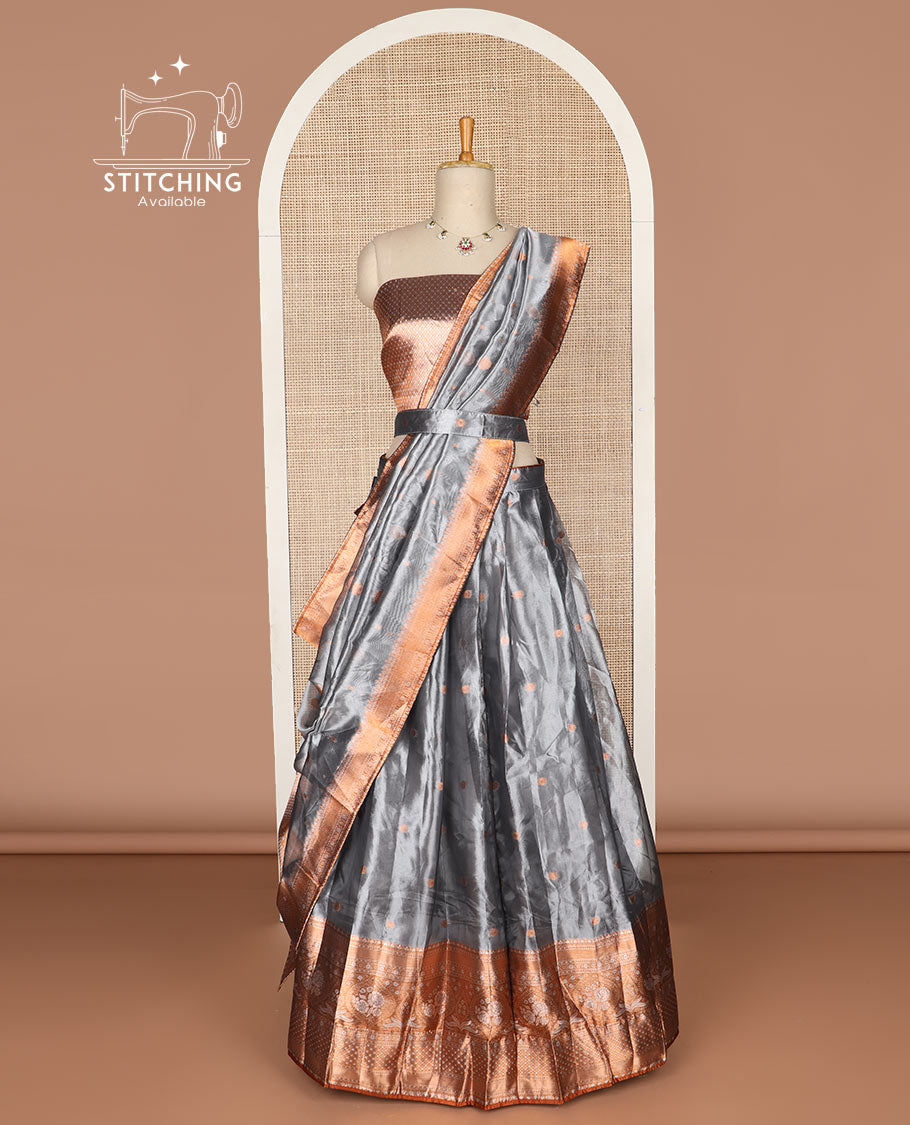Grey buttas tissue half saree with contrast zari design border, checked zari design blouse & floral design dhavani