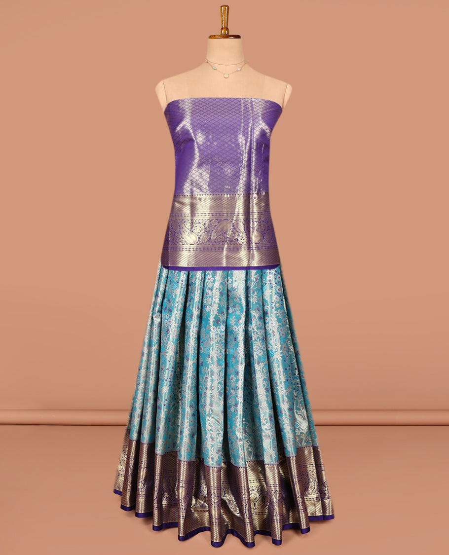 Blue Art Silk Pavadai Material Set, Spotlighted with Floral Jacquard on Its Skirt, Complemented by a Contrast Floral Zari Design Border, and Paired with a Contrast Jacquard Blouse