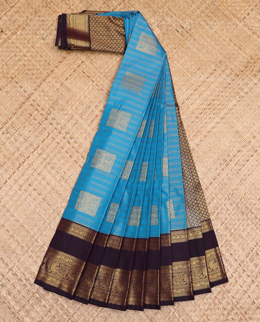 Blue zari buttas gift saree, contrast traditional zari design rettai pettu border, and zari-rich jaal pallu