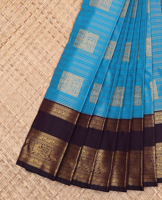 Blue zari buttas gift saree, contrast traditional zari design rettai pettu border, and zari-rich jaal pallu
