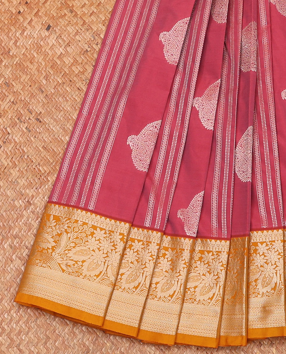 Pink striped and paisley buttas budget silk saree, contrast traditional zari design border, and pallu steeped with paisleys