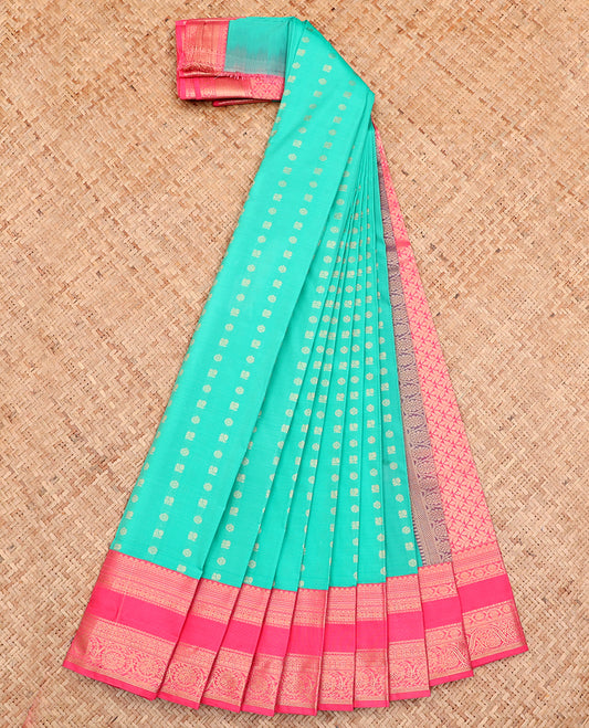 Turquoise Budget Silk Saree, Ornamented with Zari Buttas All Over Its Body, Complemented by a Contrast Traditional Zari Design Rettai Pettu Border, Grand Pallu, and Paired with a Contrast Blouse