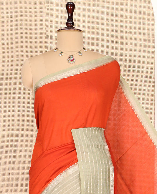 Sandal Plain Assam Silk Saree, Complemented by a Contrast Traditional Zari Design Border, Pallu Steeped with Zari Stripes, and Paired with a Contrast Blouse