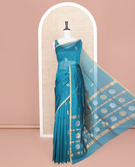 Blue Chanderi Cotton Saree, Decorated with Zari Buttas All Over Its Body, Highlighted by a Zari Piping Border, Pallu Steeped with Zari Buttas, and Paired with a Matching Blouse