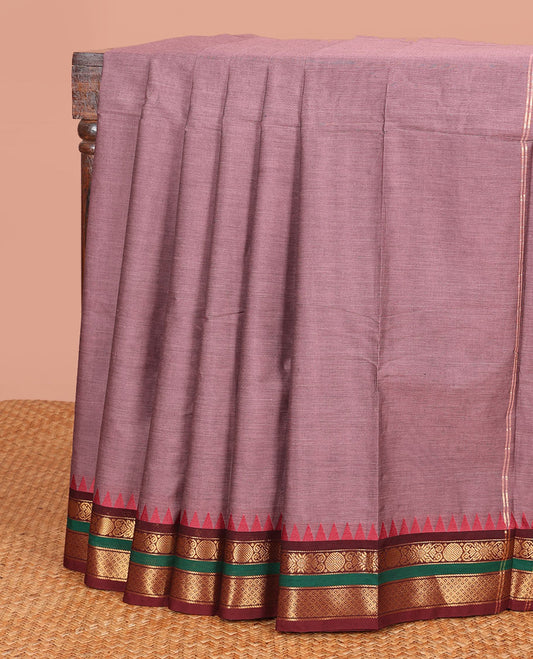 Brown Plain Chettinad Cotton Saree, Complemented by a Contrast Traditional Motifs Woven Zari Rettai Pettu Temple Border, and Gleaming Zari Striped Pallu