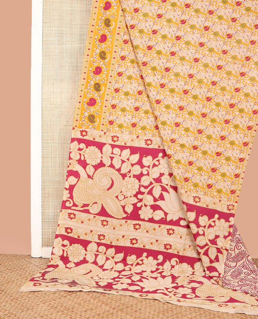 Yellow Machine-Printed Kalamkari Cotton Saree, Embellished with Batik-Style Leaf Vine Printed on Its Body, Batik Floral Printed Border, Pallu of Floral and Peacock Print, and Paired with a Printed Blouse