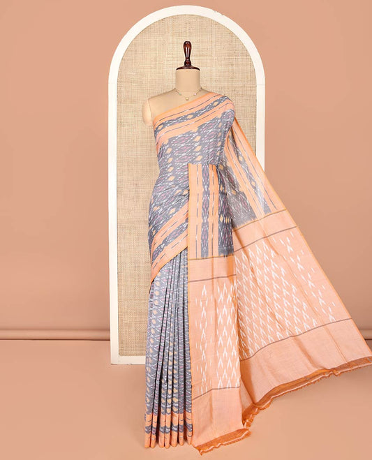 Grey Ikkat Cotton Saree, Decorated with Ikkat-Style Ogee Patterns on Its Body, Complemented by Contrast Ikkat-Textured Border, Pallu Steeped with Ikkat Buttas, and Has No Blouse