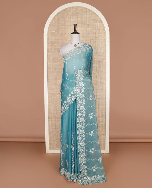 Blue zig-zag striped designer saree, floral motifs embroidered scallop border