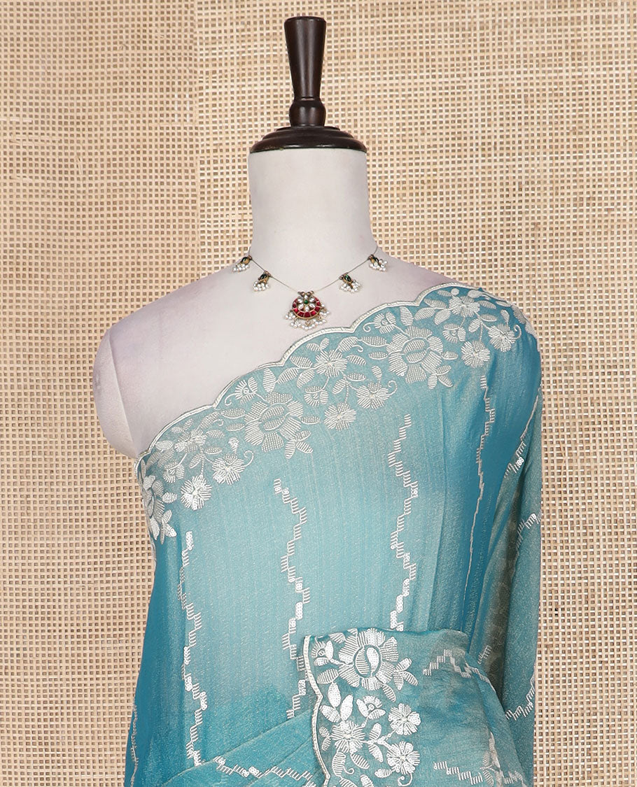 Blue zig-zag striped designer saree, floral motifs embroidered scallop border