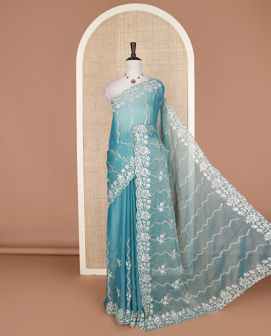 Blue zig-zag striped designer saree, floral motifs embroidered scallop border