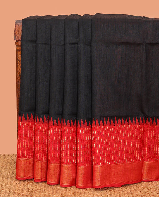 Black plain dupion saree, contrast zari striped temple border, and zari striped pallu