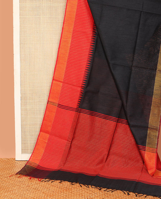 Black plain dupion saree, contrast zari striped temple border, and zari striped pallu