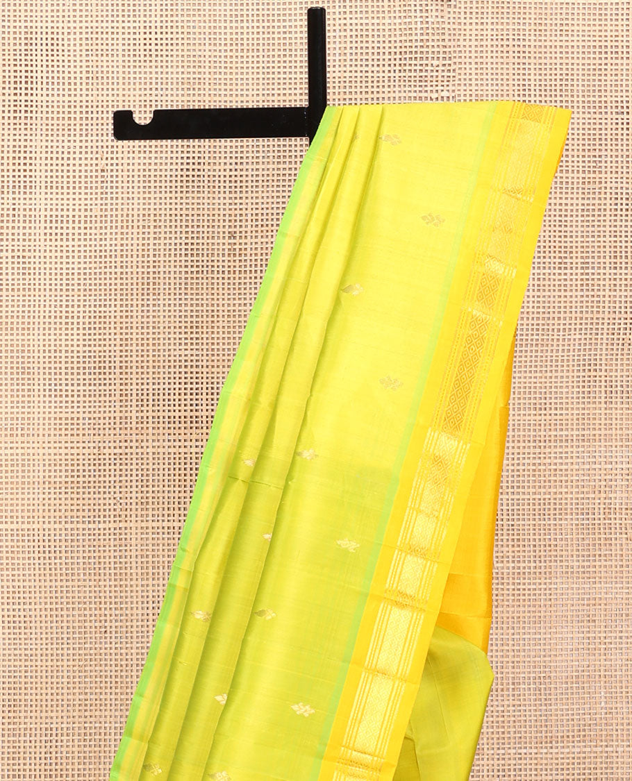 Green Kanchipuram Silk Saree, Accentuated with Zari Buttas, a Contrast One-Sided Border of Banaras, Muthu, and Mayil Kannu, Zari Design Pallu, and No Blouse