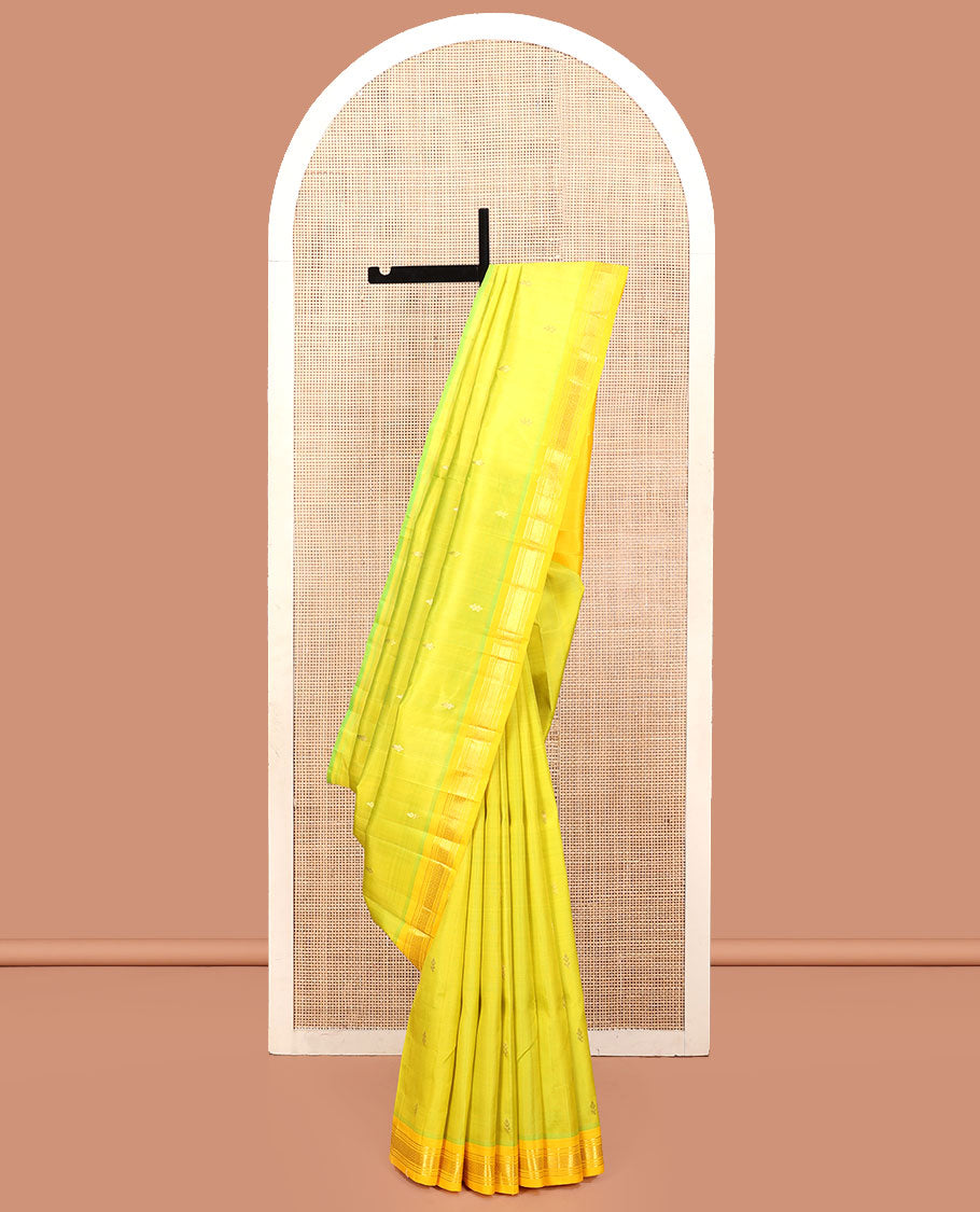 Green Kanchipuram Silk Saree, Accentuated with Zari Buttas, a Contrast One-Sided Border of Banaras, Muthu, and Mayil Kannu, Zari Design Pallu, and No Blouse