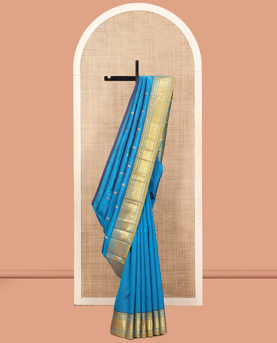 Blue Kanchipuram Silk Saree, Gleamed Up with Zari Buttas, a Contrast One-Sided Border of Panner Sombu, Banaras, and Jaal Designs, a Zari Design Pallu, and No Blouse