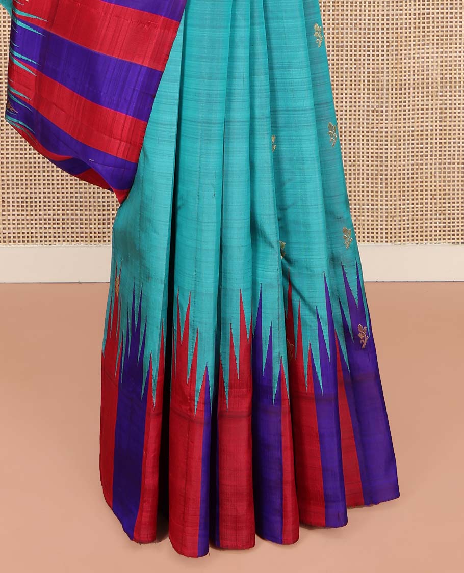 Blue Kanchipuram Silk Saree, Elevated with Zari Buttas on Its Body, Complemented by a Contrast One-Sided Thazampoo Rekku Border of Zari Buttas, Pallu Steeped with Zari Designs, and Comes Without a Blouse