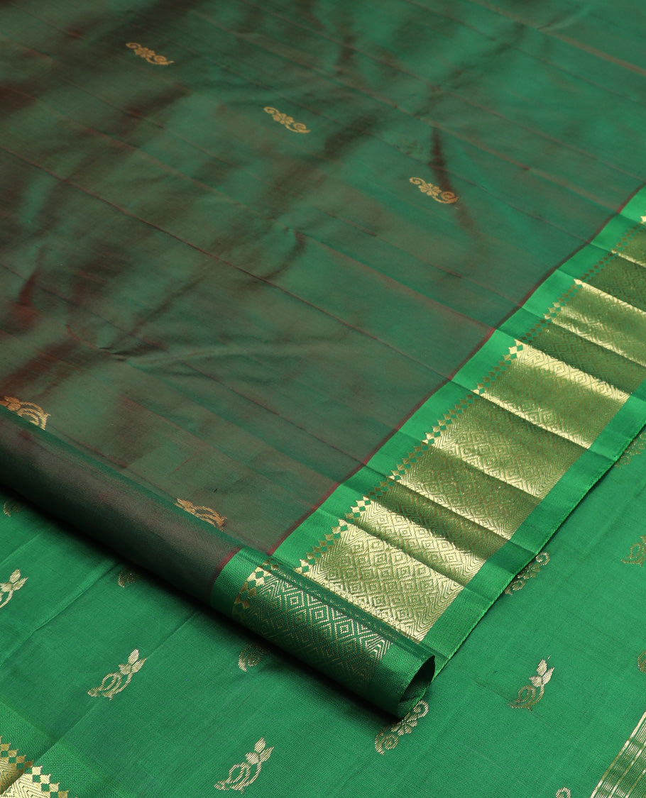 Green zari buttas Kanchipuram silk saree, contrast one-sided border of paneer sombu, kathir, and mayil kann, and zari design pallu
