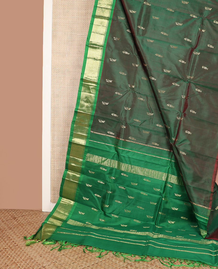 Green zari buttas Kanchipuram silk saree, contrast one-sided border of paneer sombu, kathir, and mayil kann, and zari design pallu
