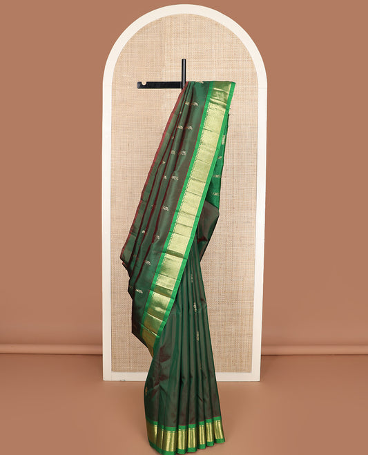 Green zari buttas Kanchipuram silk saree, contrast one-sided border of paneer sombu, kathir, and mayil kann, and zari design pallu