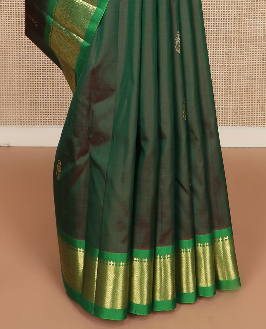 Green zari buttas Kanchipuram silk saree, contrast one-sided border of paneer sombu, kathir, and mayil kann, and zari design pallu