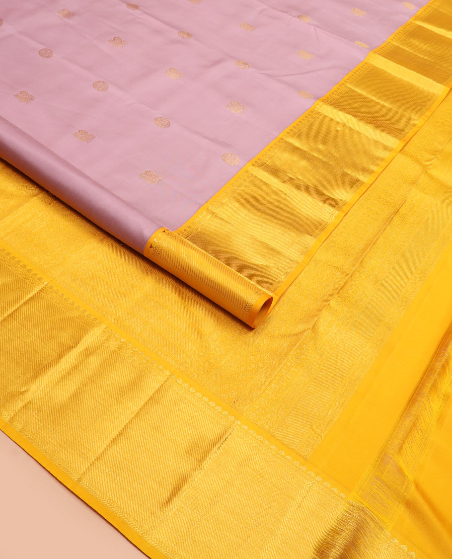Pink mayil chakram buttas Kanchipuram silk saree, contrast border of thilakam mokku, kathir, and zari stripes, and intricate pallu