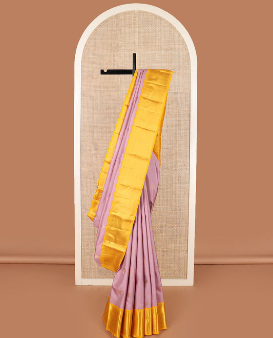 Pink mayil chakram buttas Kanchipuram silk saree, contrast border of thilakam mokku, kathir, and zari stripes, and intricate pallu