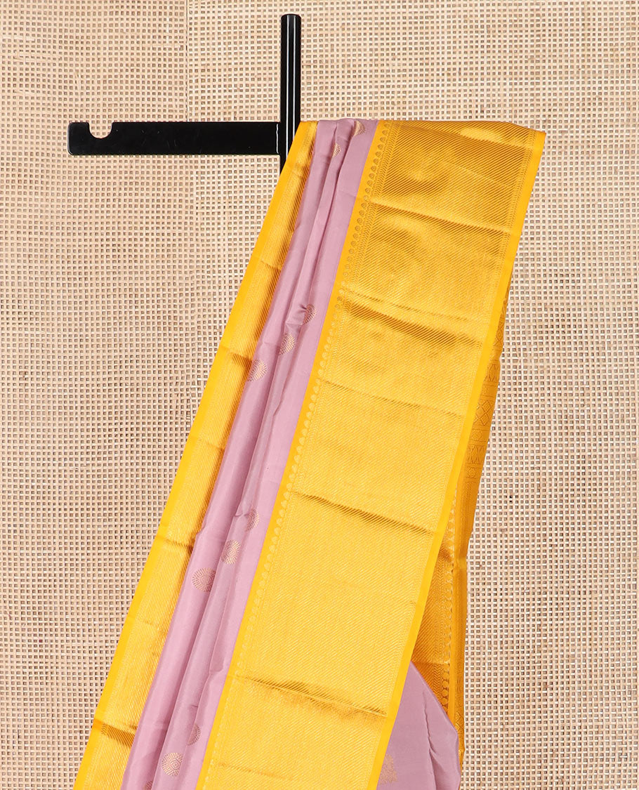 Pink mayil chakram buttas Kanchipuram silk saree, contrast border of thilakam mokku, kathir, and zari stripes, and intricate pallu