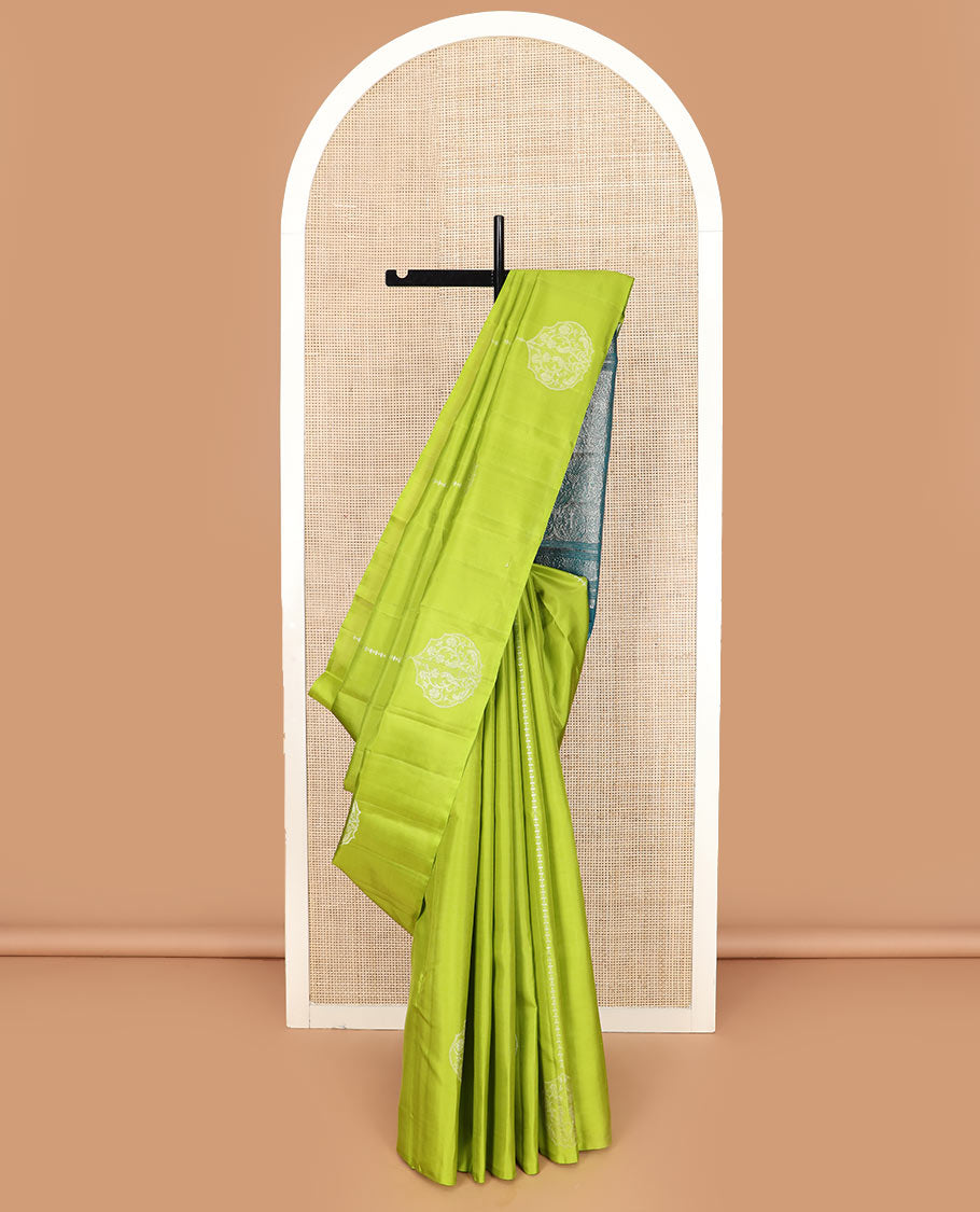 Borderless green zari buttas Kanchipuram silk saree, contrast pallu of thilakam mokku, banaras, muthu, rudraksham, annam, and floral-bird motifs