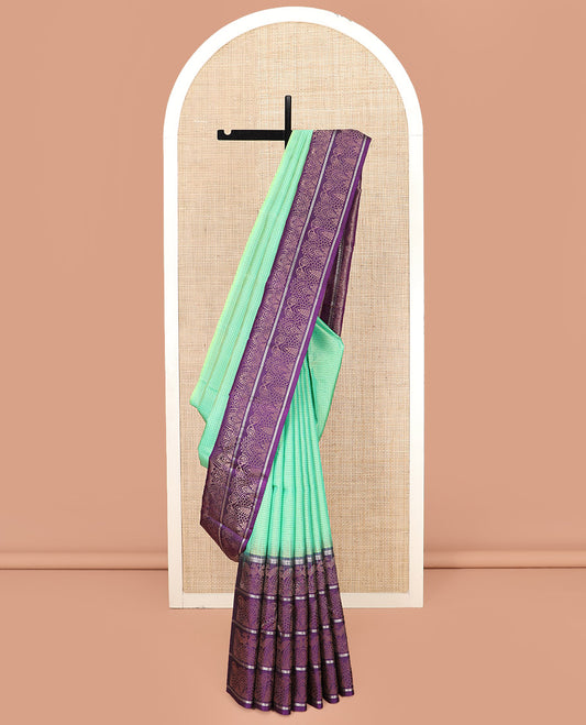 Sea Green Kanchipuram Silk Saree Sparsely Sparkled Checks on Its Body, Complemented by a Contrast Border of Floral, Paisley, and Peacock Designs, Pallu Featuring Diagonal Stripes, and Paired with a Contrast Blouse