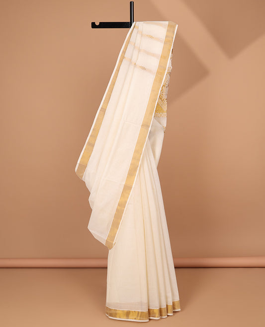 Cream kerala saree with zari stripes, zari border & pallu of intricate designs