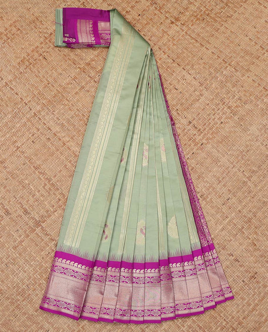 Pista Green Litchi Saree, Enriched with Zari Buttas and Stripes, a Contrast Traditional Zari Border, a Grand Pallu, and a Contrast Blouse