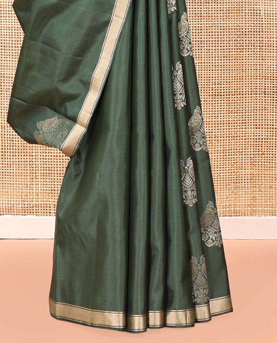 Green Mayuri Soft Silk Saree, Entralled with Zari Buttas All Over Its Body Highlighted iby Zari Piping Border, Intricately Designed Pallu and Paired with a Matching Blouse