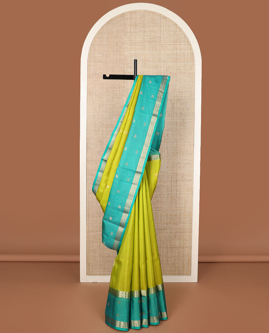 Parrot green zari buttas soft silk saree, contrast zari checked border of thilakam, banaras, mayil kann & mayil designs & geometric motifs enclosed checked pallu