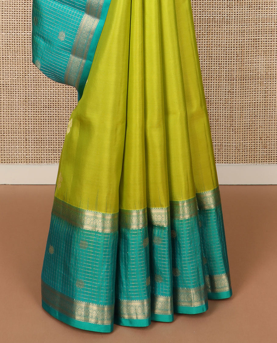 Parrot green zari buttas soft silk saree, contrast zari checked border of thilakam, banaras, mayil kann & mayil designs & geometric motifs enclosed checked pallu