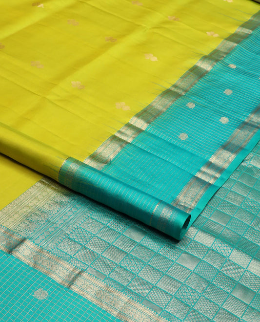Parrot green zari buttas soft silk saree, contrast zari checked border of thilakam, banaras, mayil kann & mayil designs & geometric motifs enclosed checked pallu