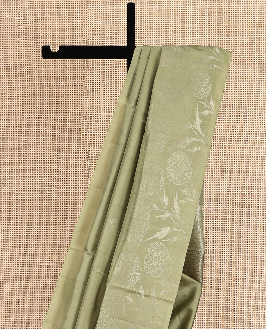 Green Mayuri Soft Silk Saree, Subtly Sparkled with Buttas, Subtle Floral Motif Border, Pallu of Floral Designs, and a Matching Blouse